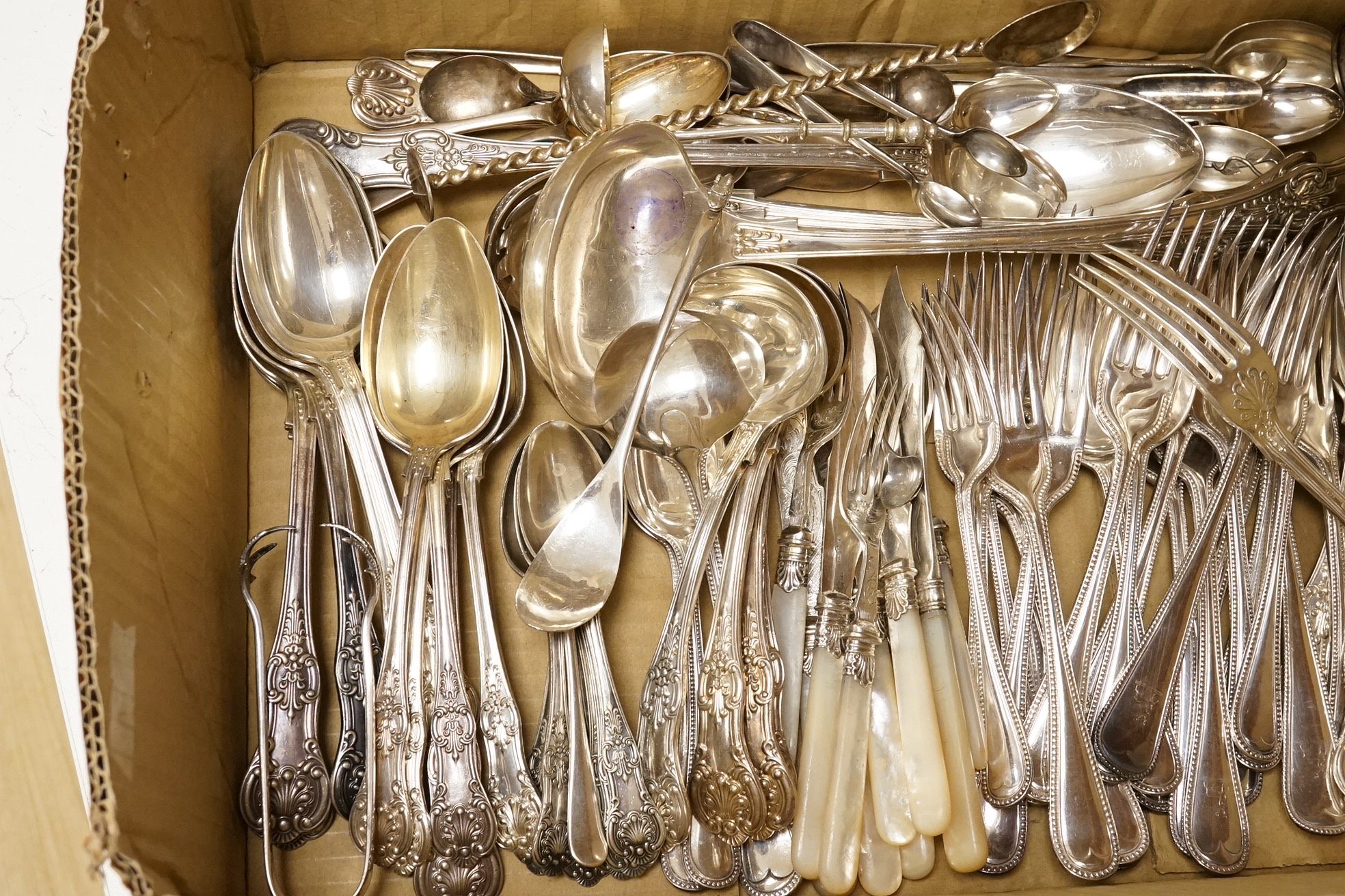 A quantity of assorted plated flatware including Kings pattern and beaded Old English pattern.
